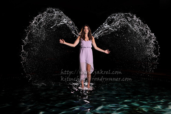 Cassie Sopher with Water Wings in a Kiddie Pool :)